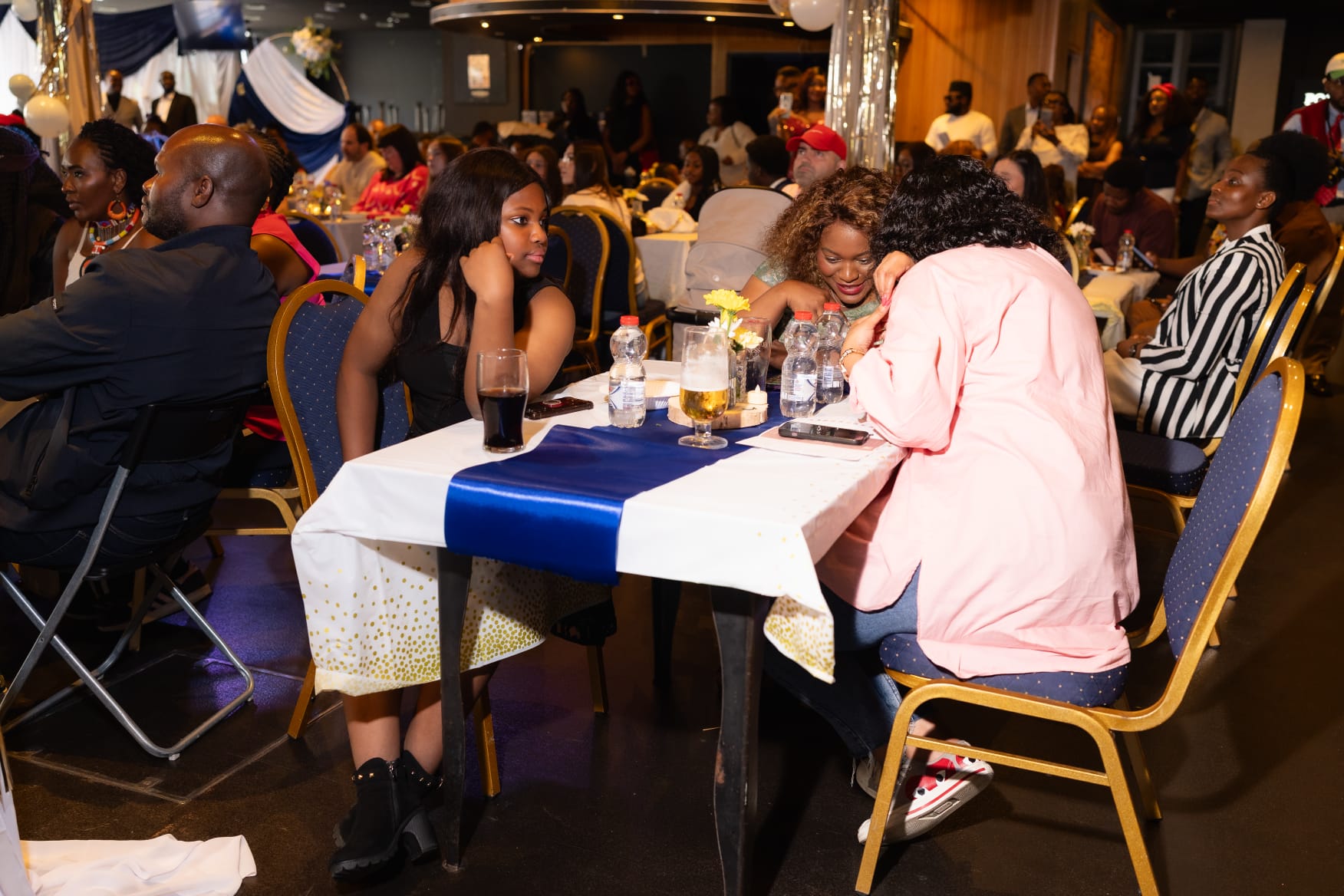 Guests talking around the tables late in the evening